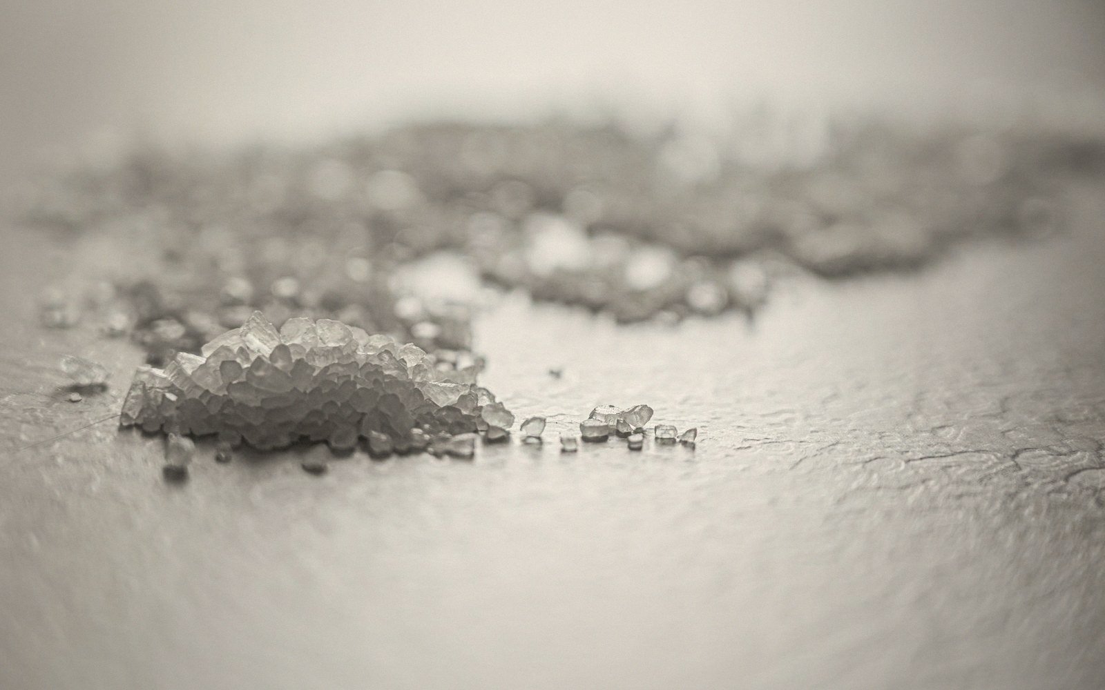 Coarse coagulant salt crystals in a small dish